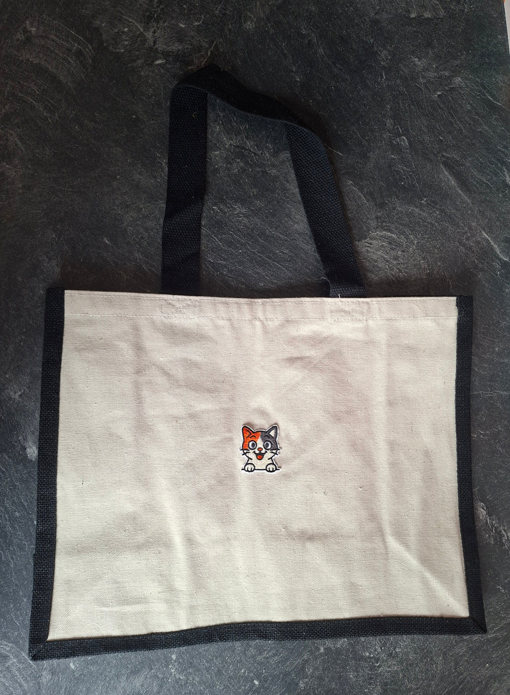 The "Purr-veillance State" jute tote