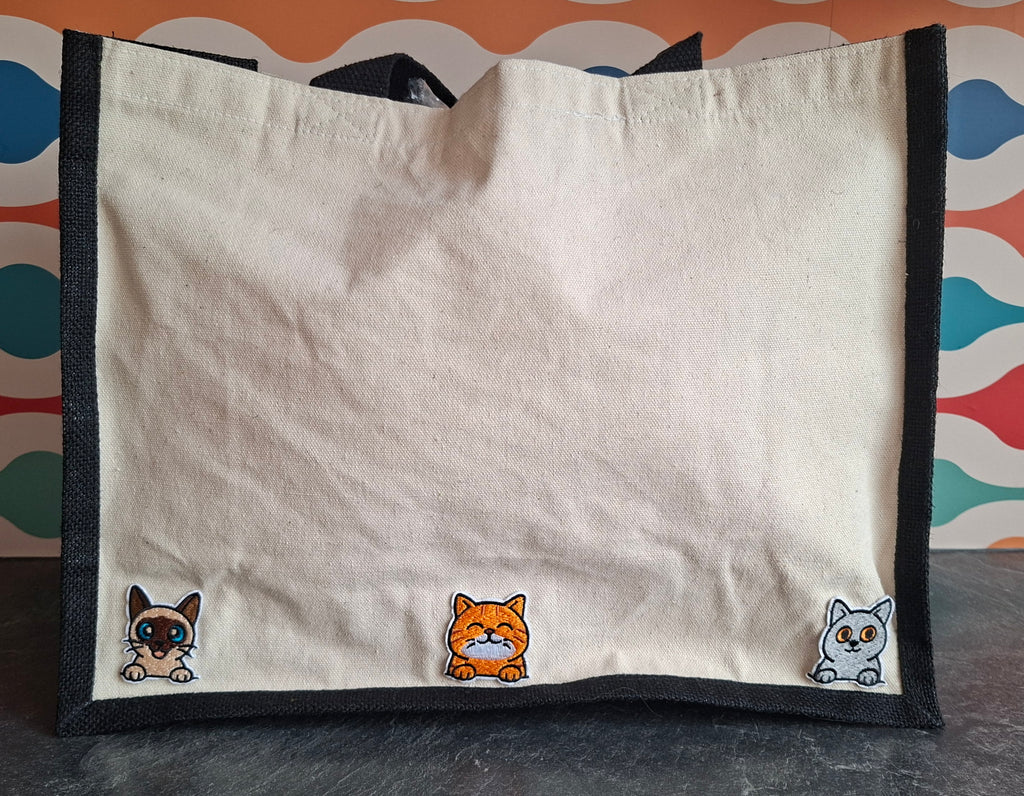 The "Purr-veillance State" jute tote