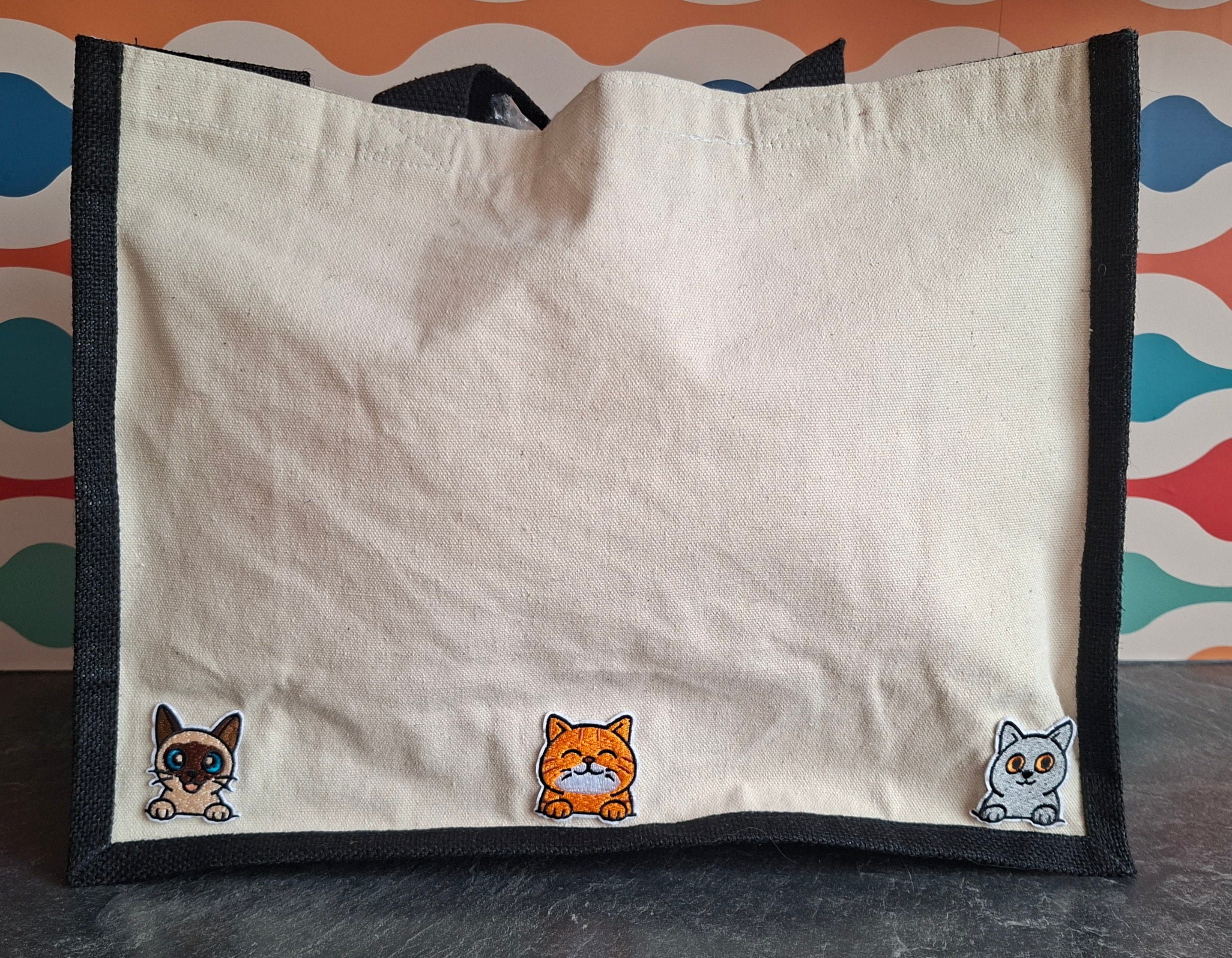 The "Purr-veillance State" jute tote