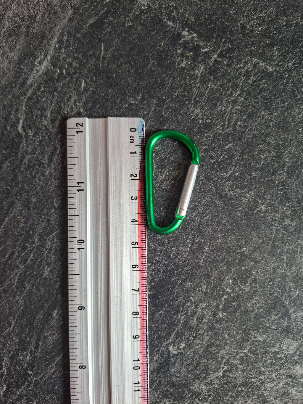 The "Holding On By A Thread" bottle carabiner