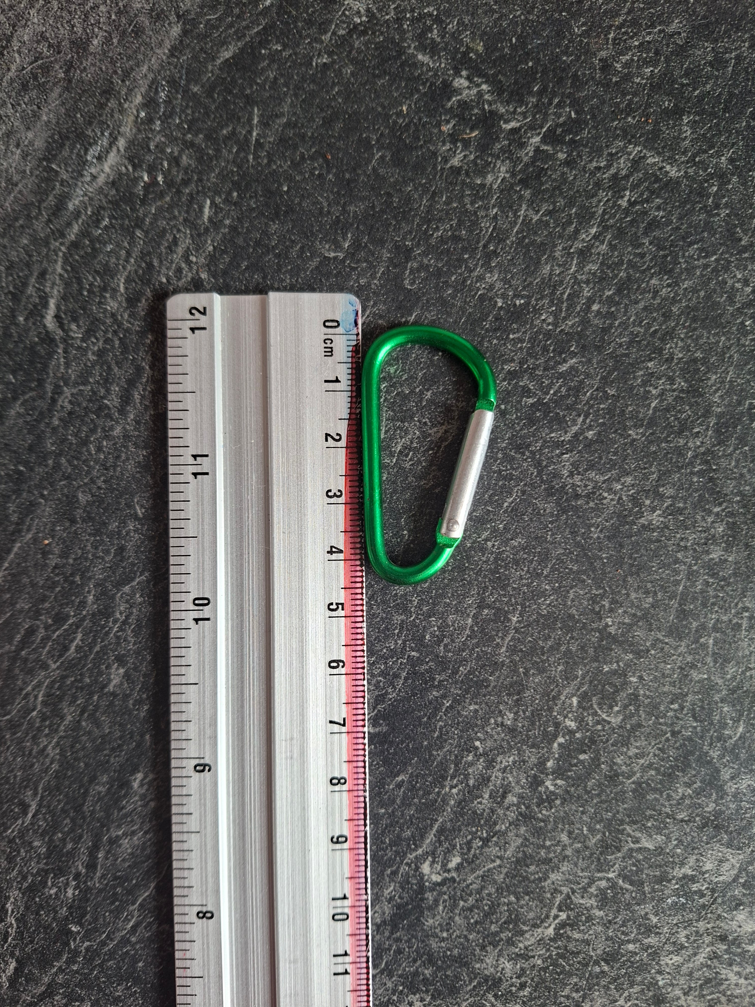 The "Holding On By A Thread" bottle carabiner