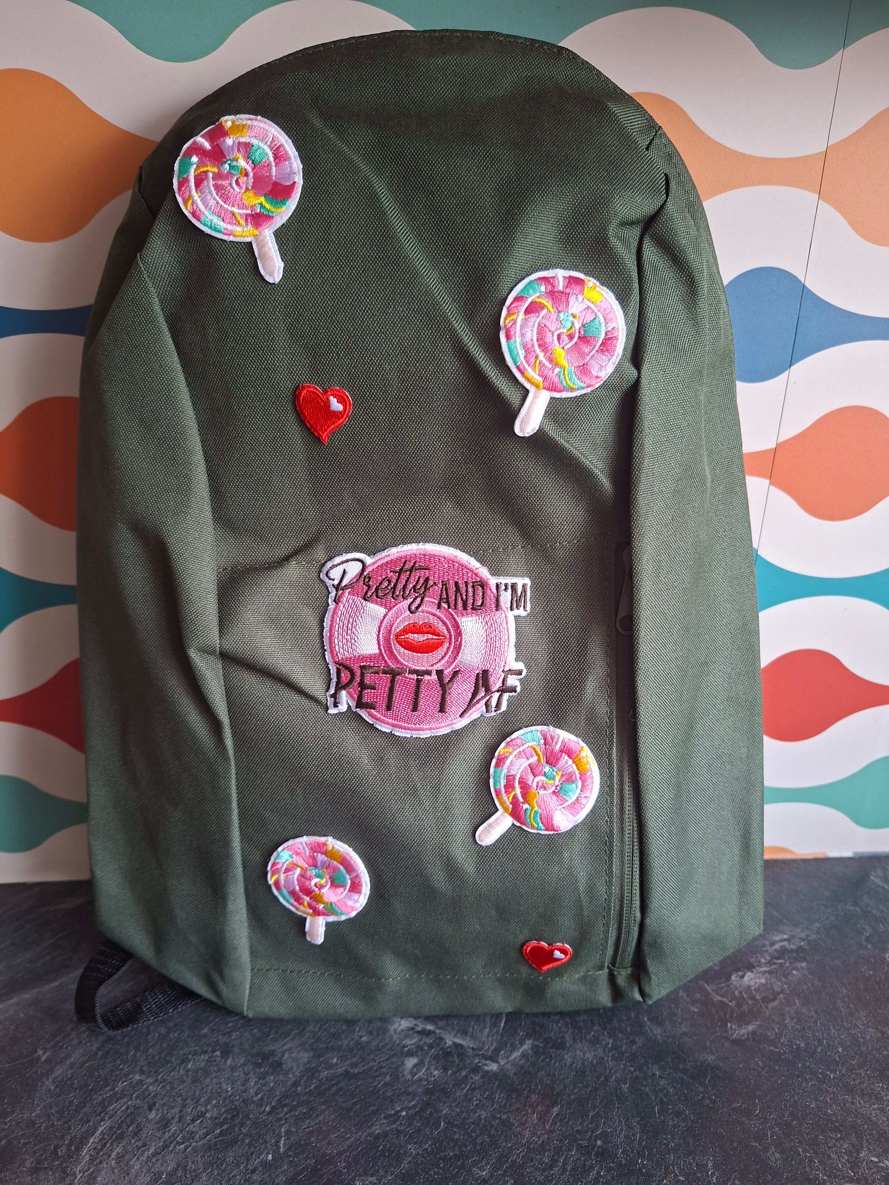 The "Looks Cute, Acts Petty" mini backpack